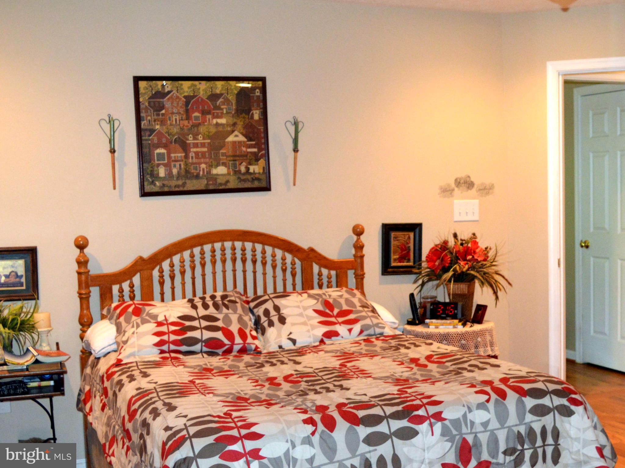 495 McCubbin Road Winchester, VA 22603 - Photo 9 of 29 a bedroom with a bed and a dresser
