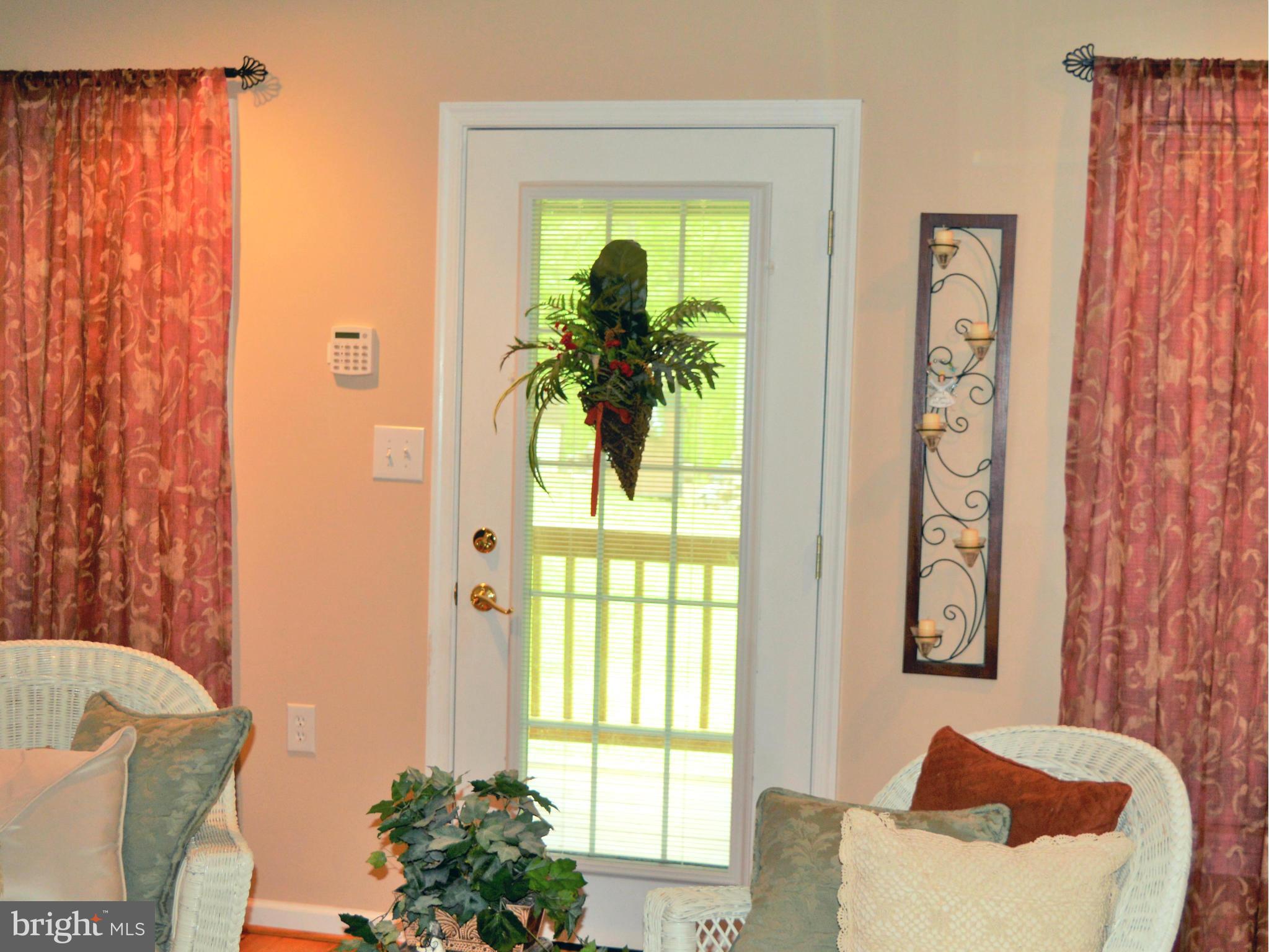 495 McCubbin Road Winchester, VA 22603 - Photo 10 of 29 a living room with furniture and a window
