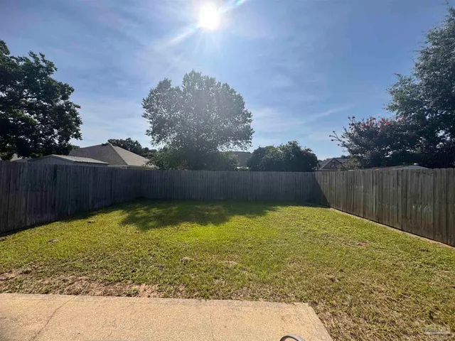 a view of backyard with tree