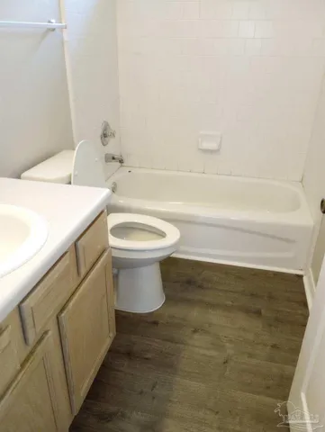 a bathroom with a sink a toilet and bathtub