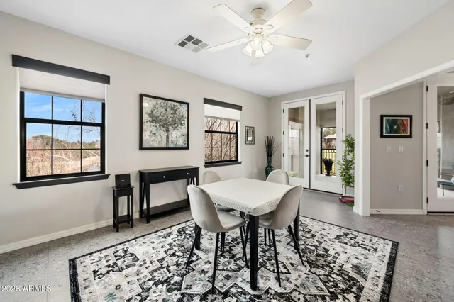 a view of a livingroom with furniture and a window