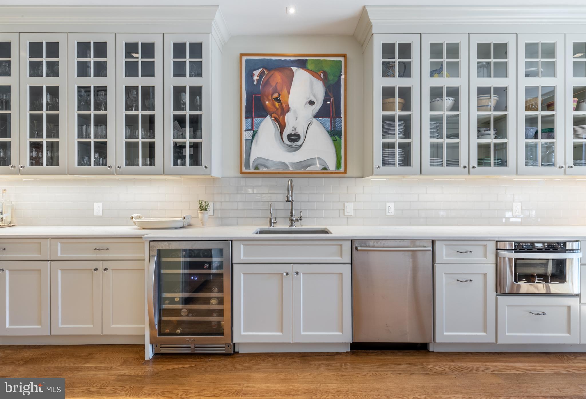 1854 Kalorama Road Northwest Washington, DC 20009 - Photo 13 of 43 Under-cabinet lighting and wine cooler