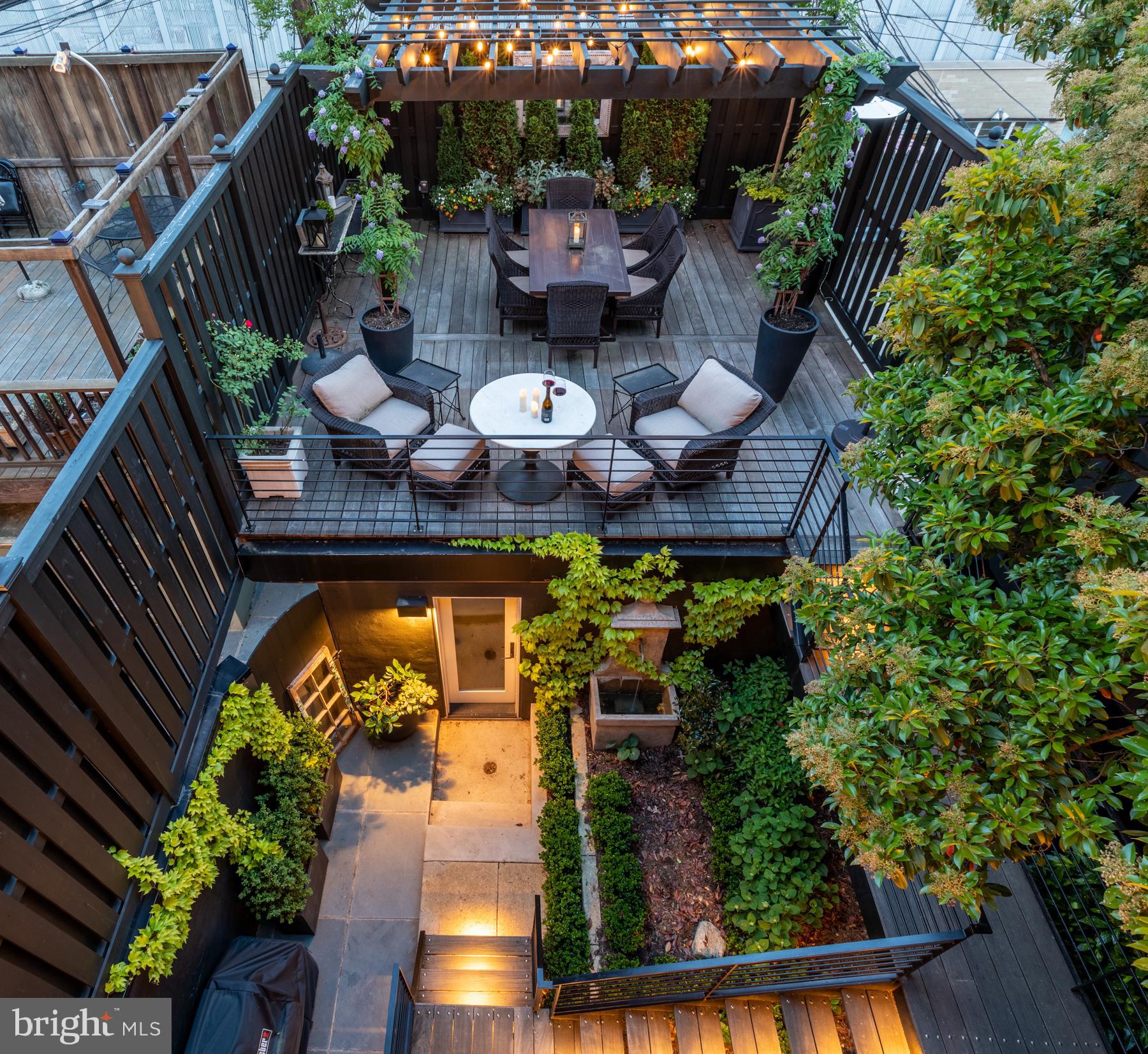 1854 Kalorama Road Northwest Washington, DC 20009 - Photo 38 of 43 Water feature and lush landscaping create an oasis