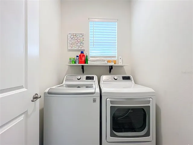 a utility room with dryer and washer