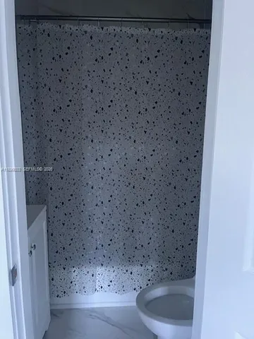 a bathroom with a toilet and a sink