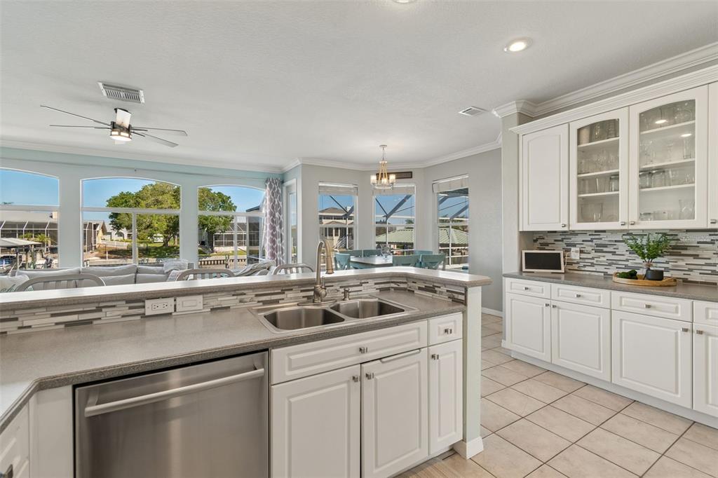 703 Bunker View Drive Apollo Beach, FL 33572 - Photo 13 of 49 a kitchen with a sink and cabinets