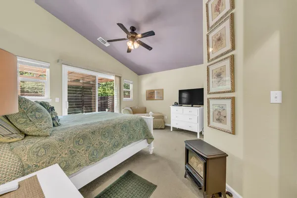 a bed sitting in a room next to a window