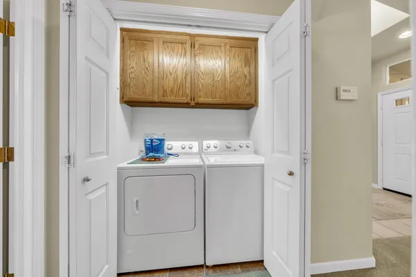 a view of a patio with a dining table and chairs