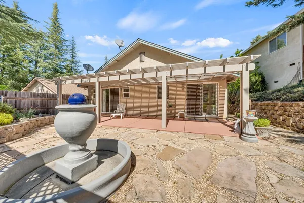 a view of a backyard of the house