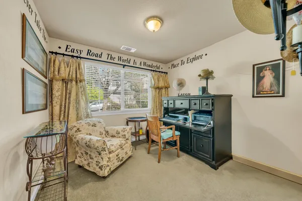 a bedroom with furniture and a window