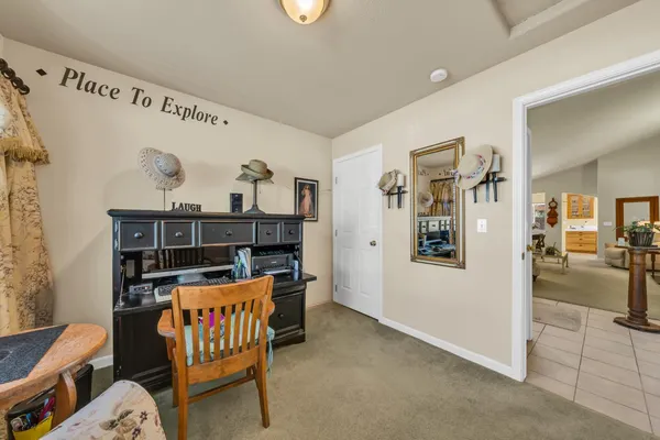a view of a hallway with seating area