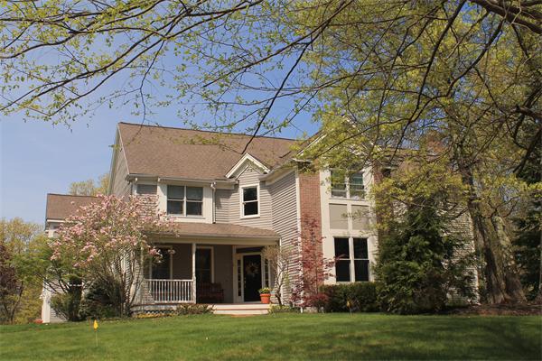 front view of a house with a yard