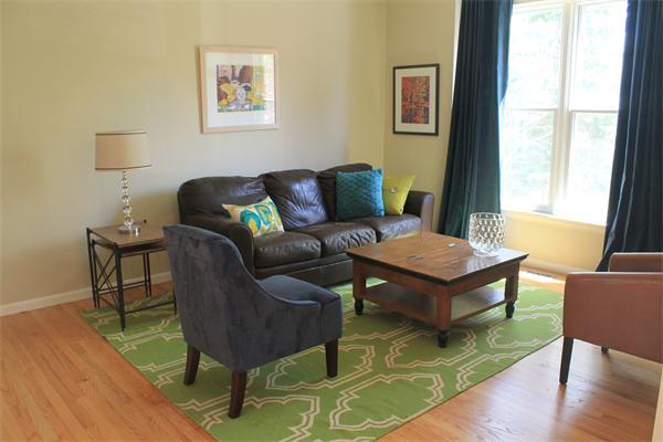19 Pendulum Pass Hopkinton, MA 01748 - Photo 13 of 30 a living room with furniture a wooden floor and a table