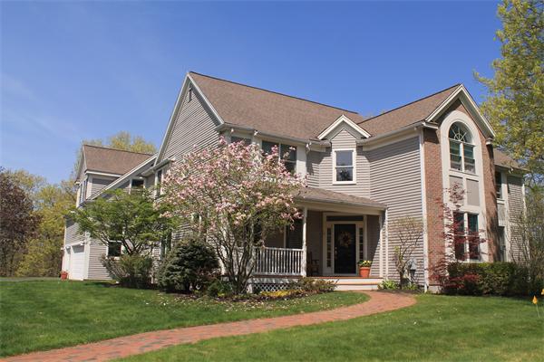 19 Pendulum Pass Hopkinton, MA 01748 - Photo 2 of 30 a front view of a house with a yard