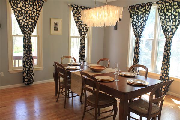 19 Pendulum Pass Hopkinton, MA 01748 - Photo 5 of 30 a view of a dining room with furniture and chandelier