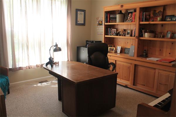 19 Pendulum Pass Hopkinton, MA 01748 - Photo 6 of 30 a room with a table chairs and a shelf