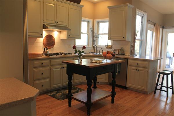 19 Pendulum Pass Hopkinton, MA 01748 - Photo 7 of 30 a kitchen with sink cabinets and wooden floor