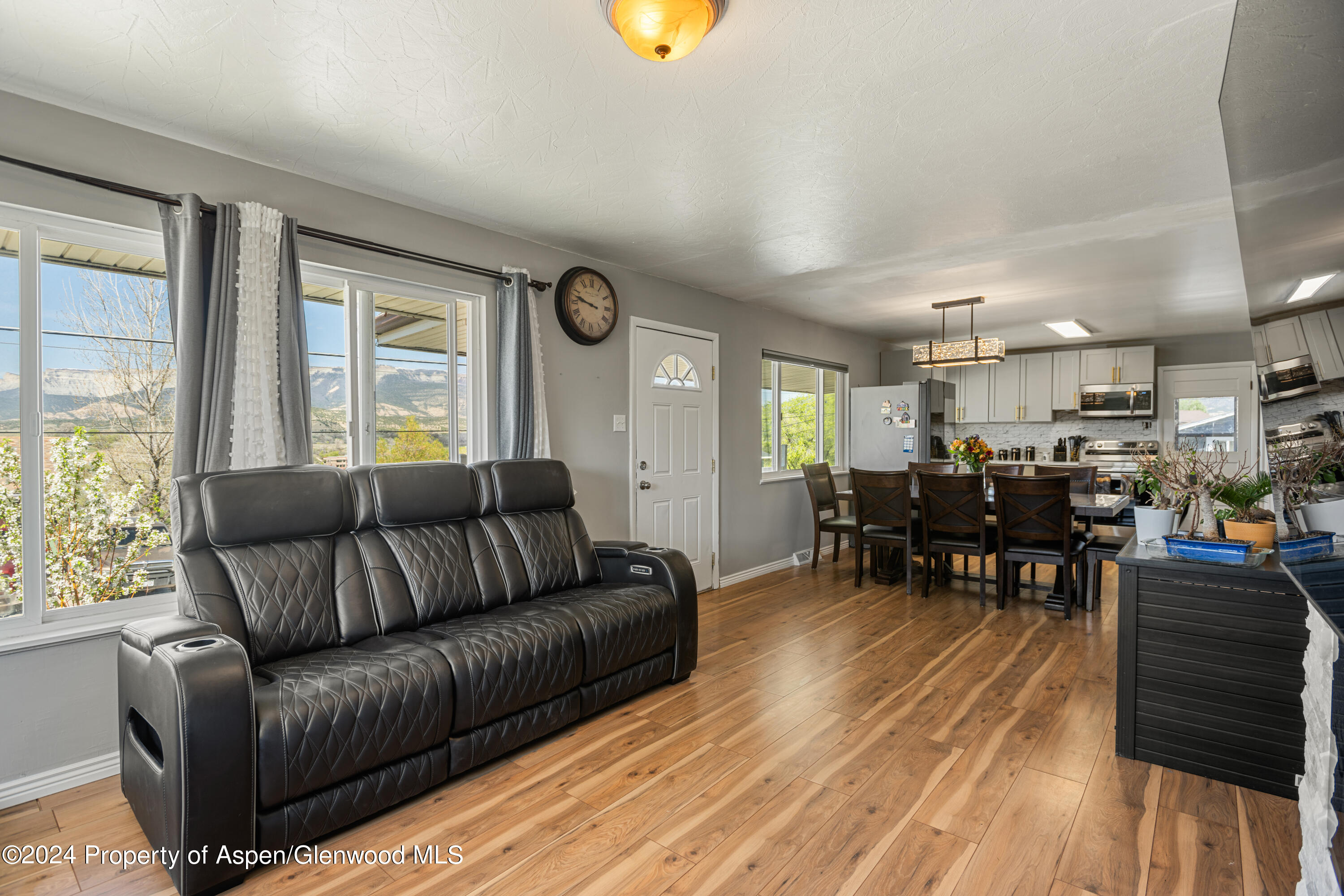1100 Clarkson Avenue Rifle, CO 81650 - Photo 2 of 13 a living room with furniture and wooden floor