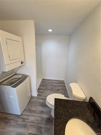 a bathroom with a sink toilet and vanity