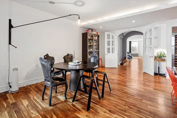 a view of a dining room with furniture and wooden floor