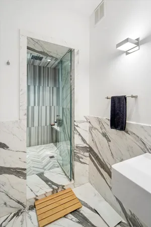 a bedroom with a bed and a mirror