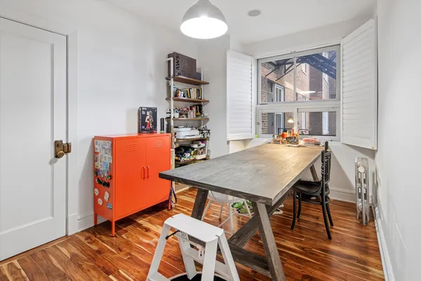 a view of a dining room with furniture and a table