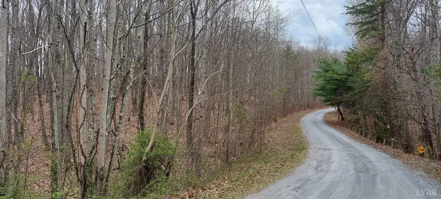 a view of balcony with wooden floor and fence