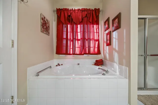 a room with round mirror and sink
