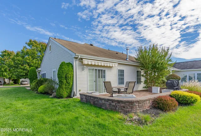 a view of a house with backyard outdoor seating area and sitting area