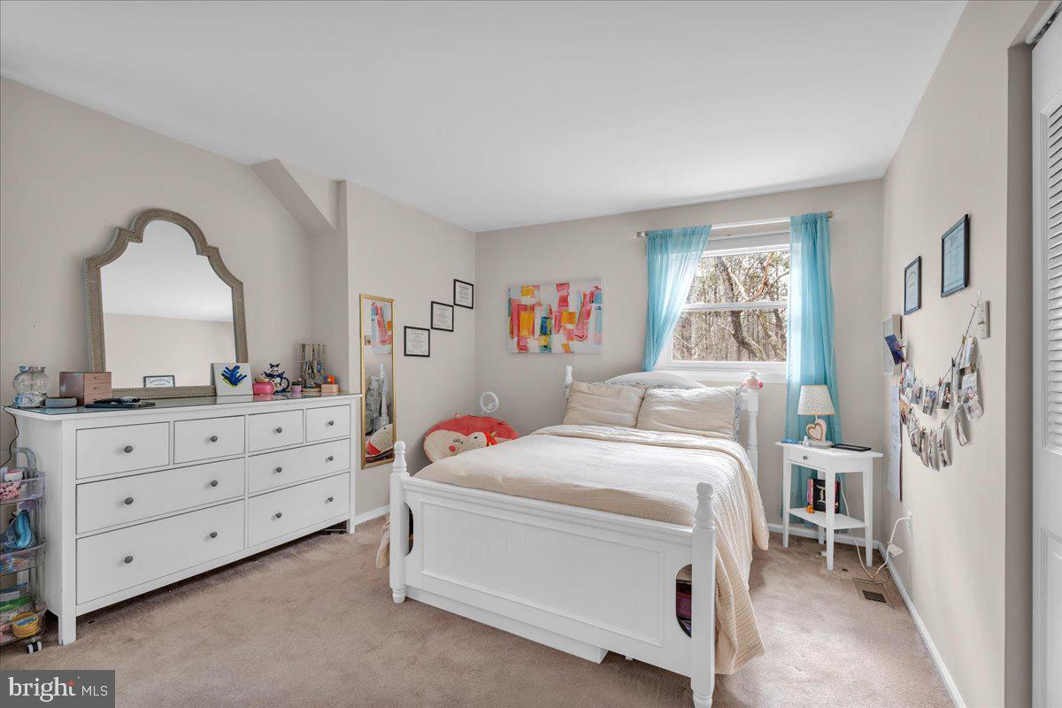 128 Bortons Road Marlton, NJ 08053 - Photo 22 of 48 a bedroom with a bed and a dresser in it