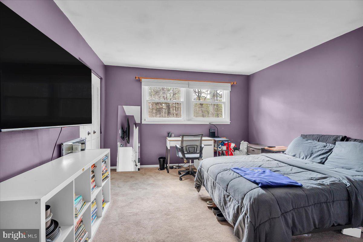 128 Bortons Road Marlton, NJ 08053 - Photo 23 of 48 a bedroom with a bed and a flat screen tv