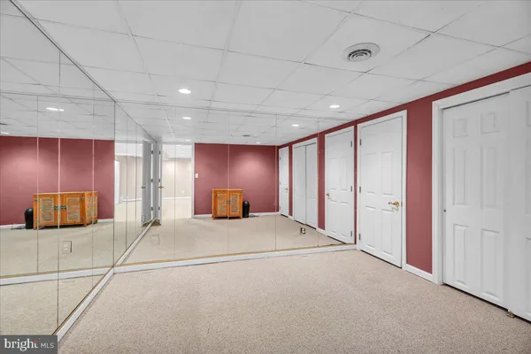 a view of a livingroom with a couch and window