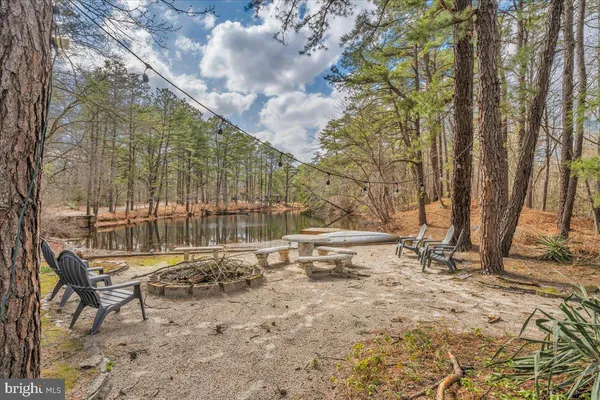 a view of backyard with a table and chairs