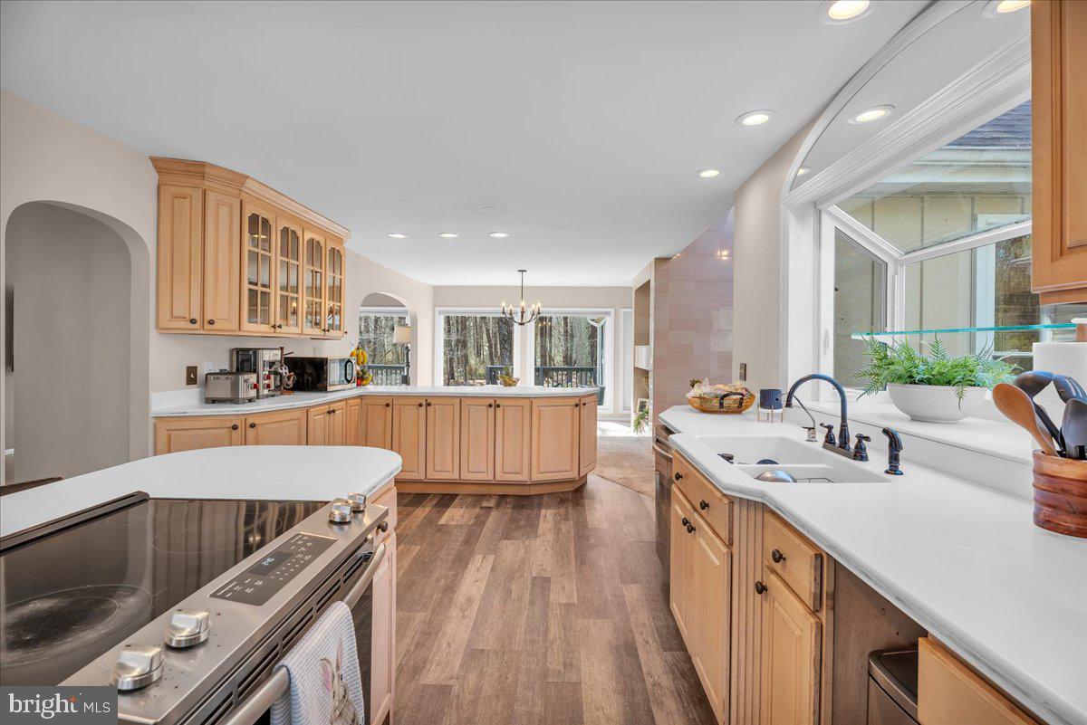 128 Bortons Road Marlton, NJ 08053 - Photo 5 of 48 a large kitchen with kitchen island a large counter top space a sink stainless steel appliances and cabinets