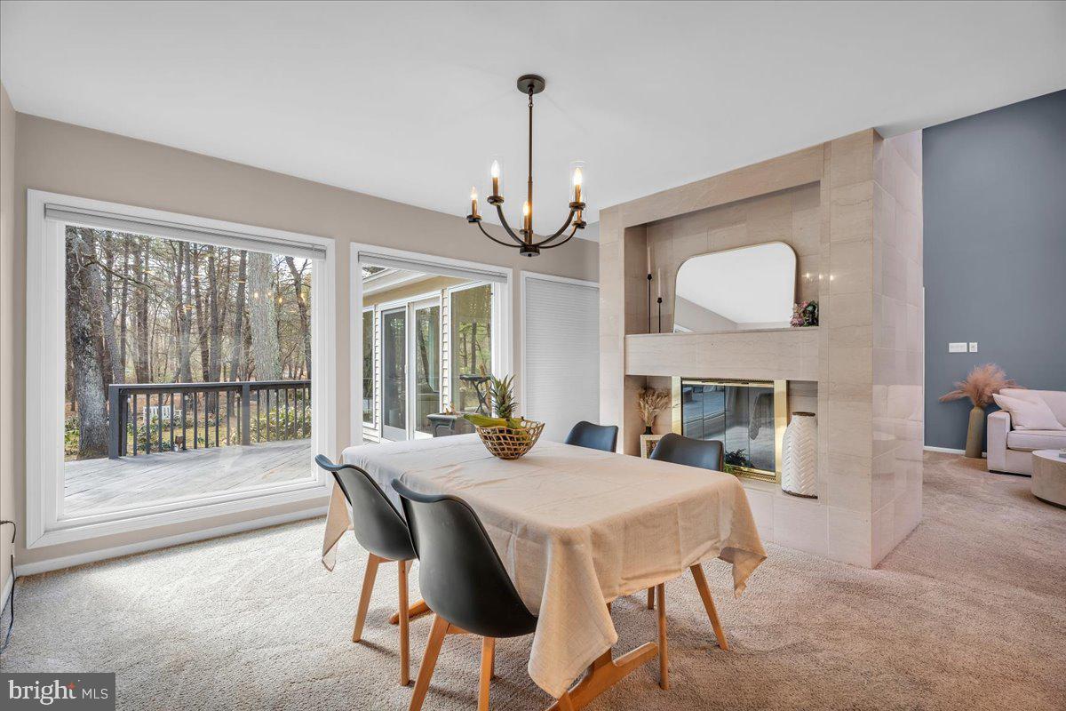 128 Bortons Road Marlton, NJ 08053 - Photo 9 of 48 a view of a dining room with furniture wooden floor and chandelier