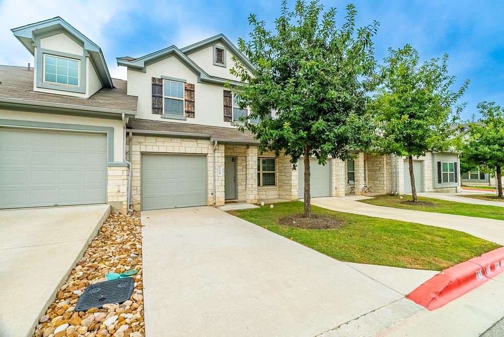 124 Thelonious Drive Austin, TX 78745 - Photo 1 of 1 front view of a house with a yard