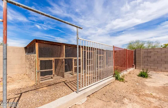 a view of a backyard with a fence