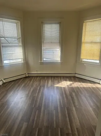 a large kitchen with lot of cabinets and appliances
