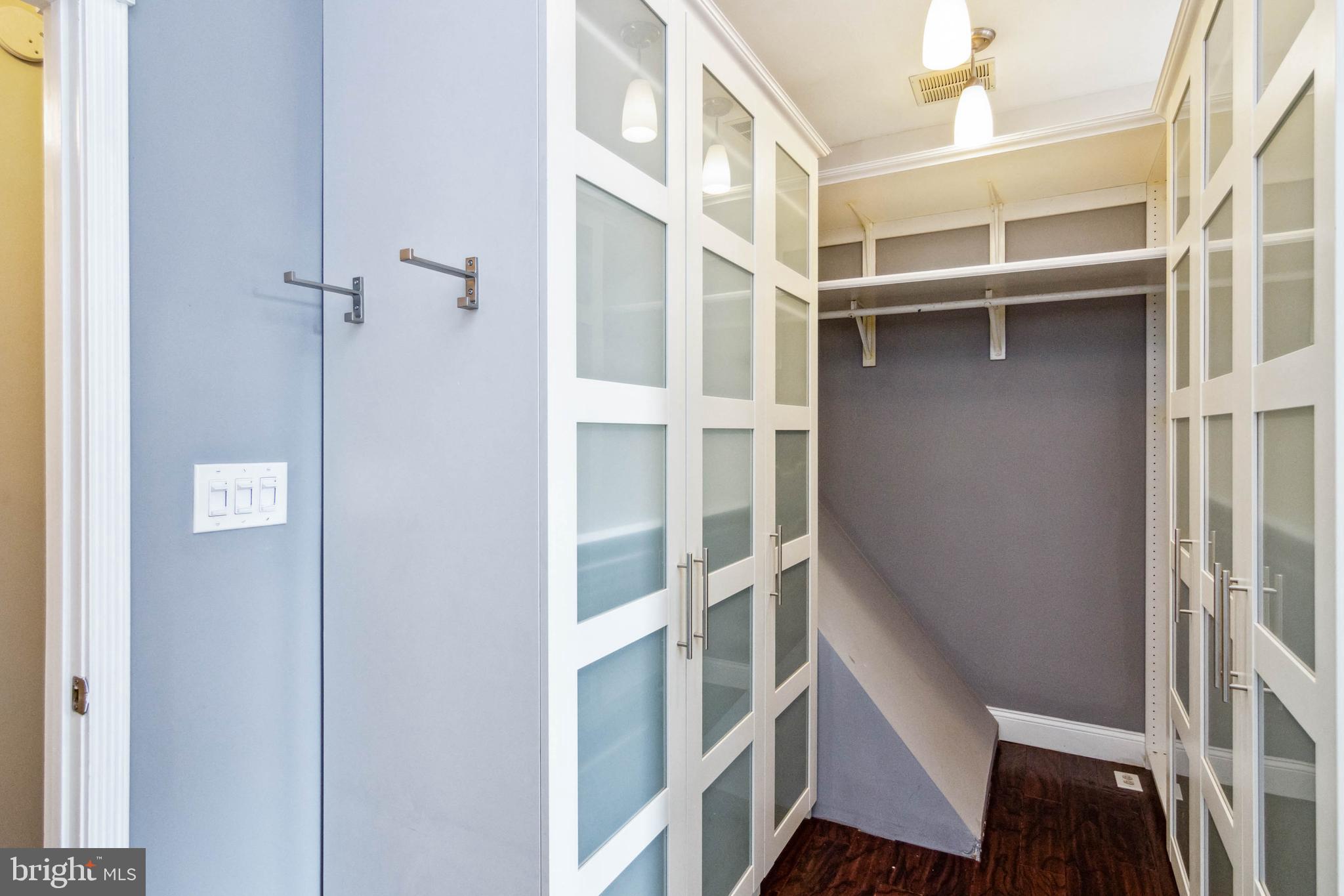 212 South Exeter Street Baltimore, MD 21202 - Photo 14 of 25 Built in closet system in primary bedroom