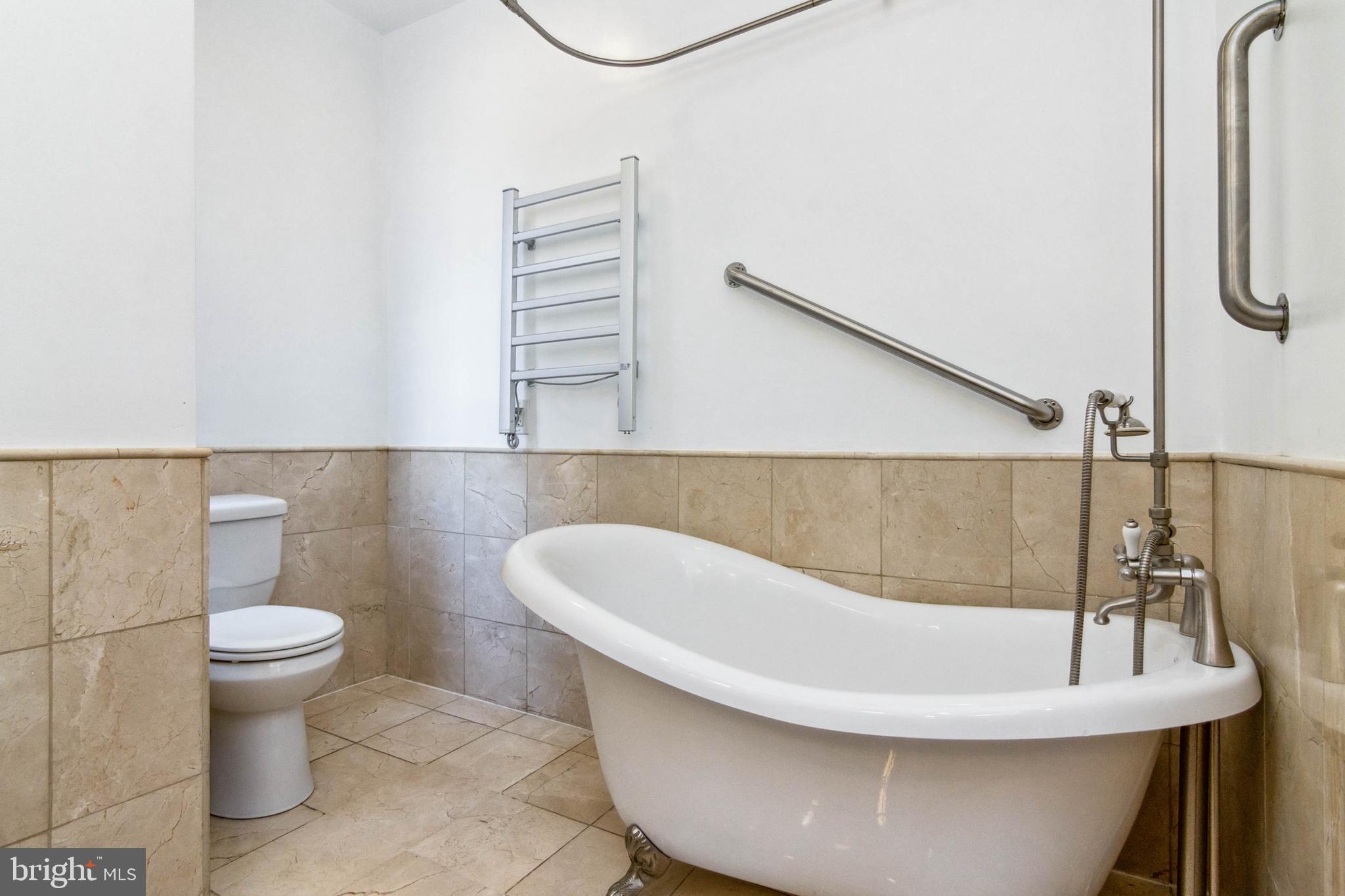 212 South Exeter Street Baltimore, MD 21202 - Photo 16 of 25 Hall bath with clawfoot tub