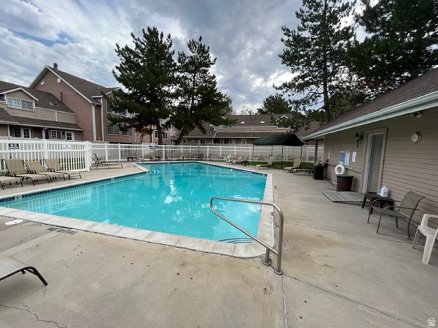 6884 670 East Midvale, UT 84047 - Photo 25 of 28 Community pool featuring a patio