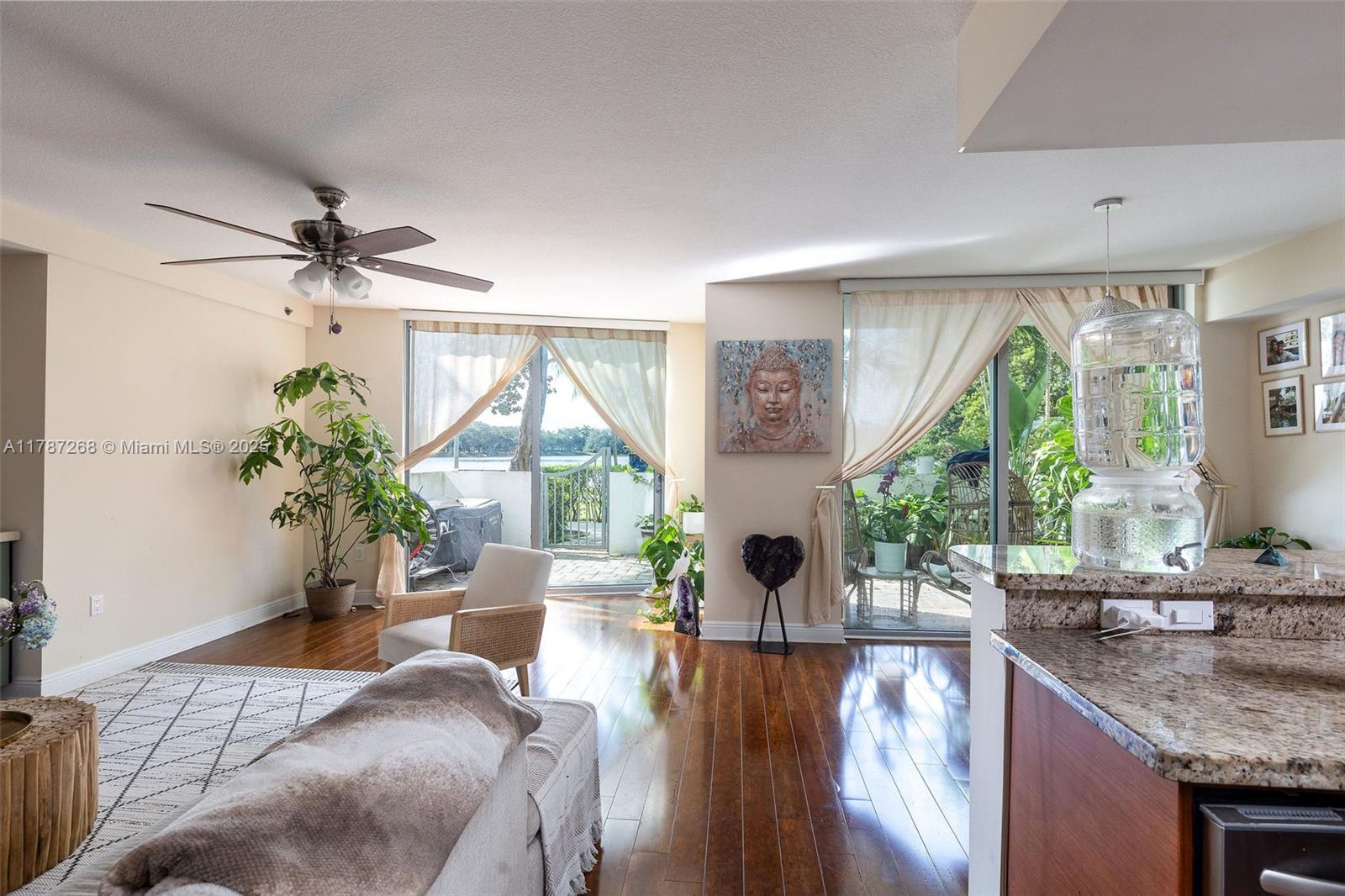 2681 North Flamingo Road, Unit TH4S Sunrise, FL 33323 - Photo 1 of 27 a living room with furniture a large window with wooden floor