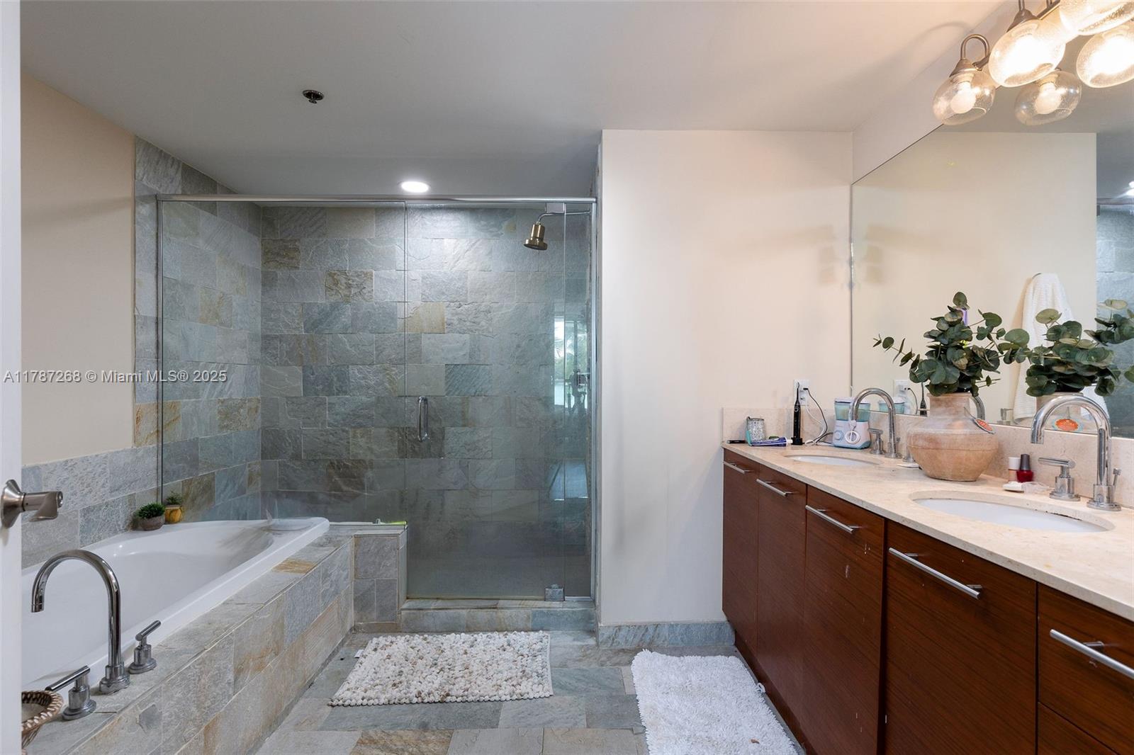 2681 North Flamingo Road, Unit TH4S Sunrise, FL 33323 - Photo 12 of 27 a bathroom with a tub sink toilet and shower