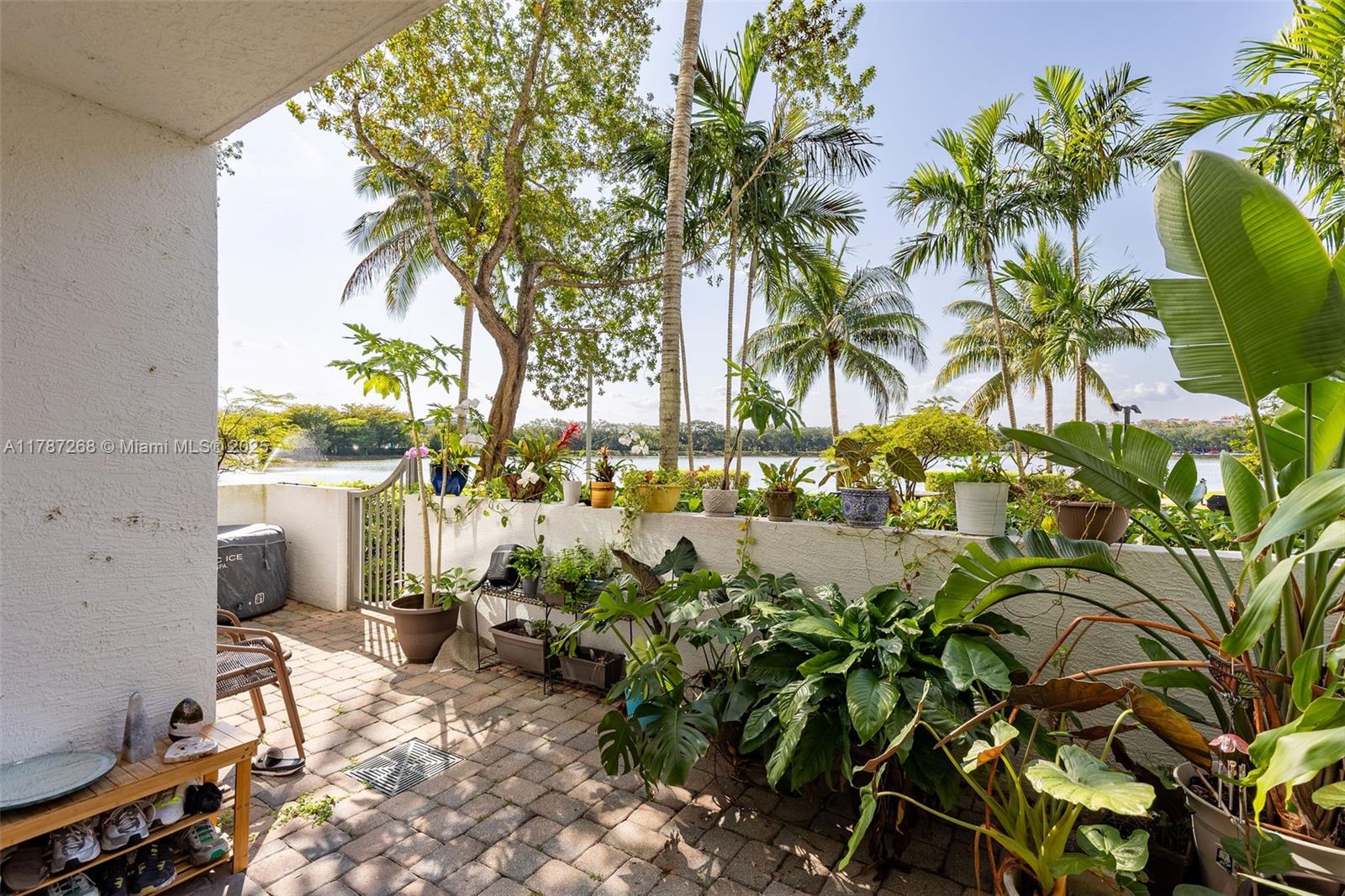 2681 North Flamingo Road, Unit TH4S Sunrise, FL 33323 - Photo 15 of 27 a row of potted plants and large trees