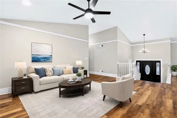 a view of empty room with a ceiling fan and a window