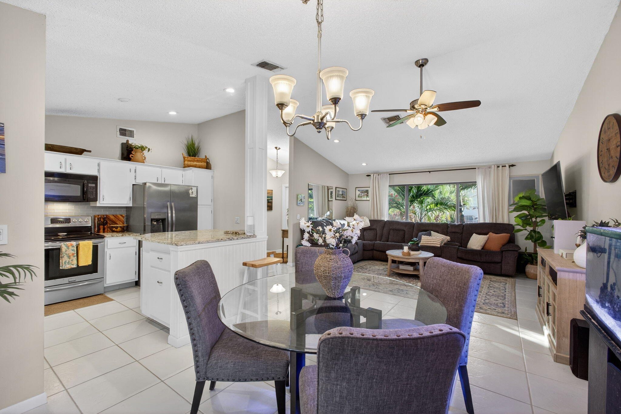 154 Rosewood Circle Jupiter, FL 33458 - Photo 15 of 43 a view of a dining room with furniture