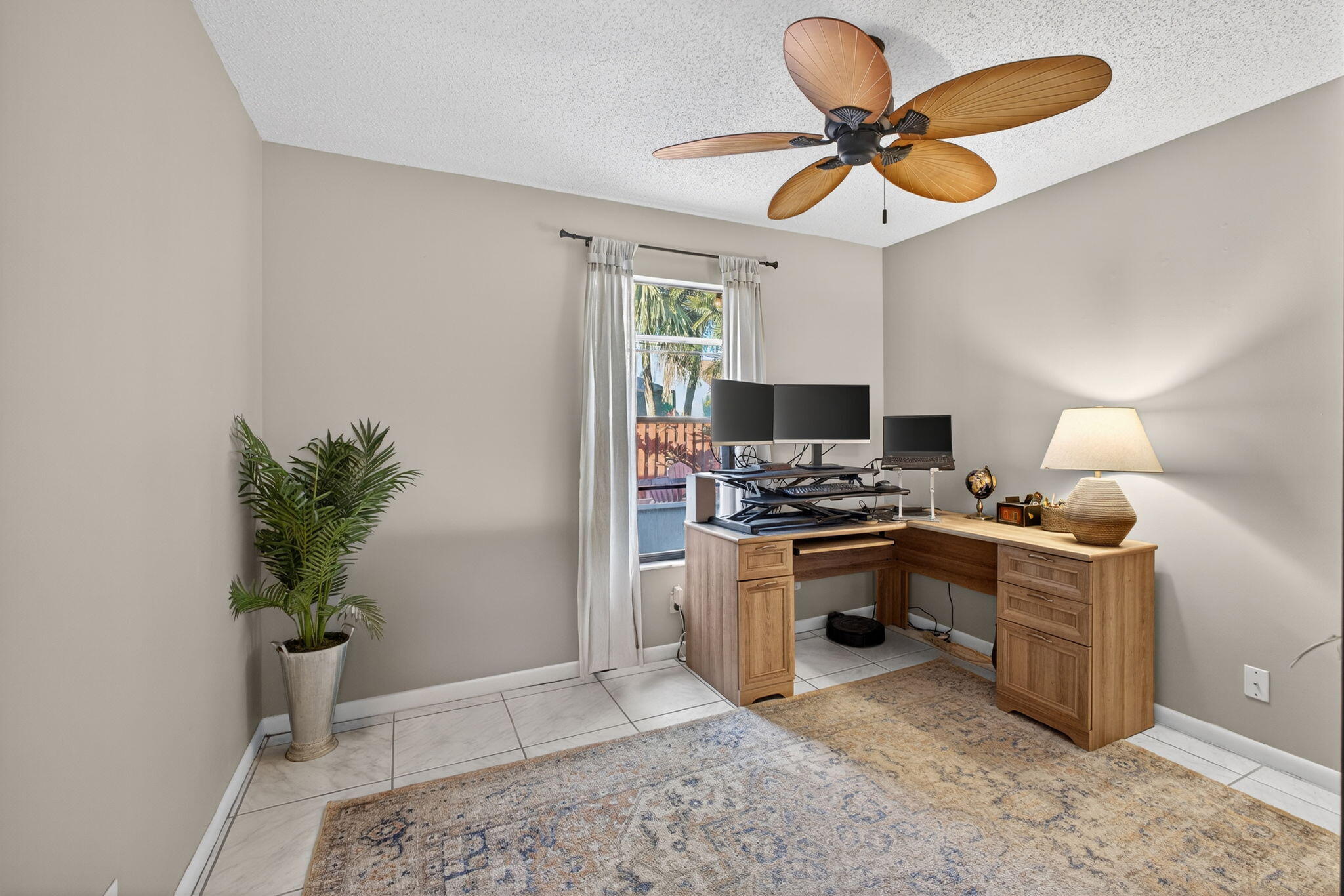 154 Rosewood Circle Jupiter, FL 33458 - Photo 23 of 43 a kitchen with stainless steel appliances granite countertop a sink a stove counter space and a window