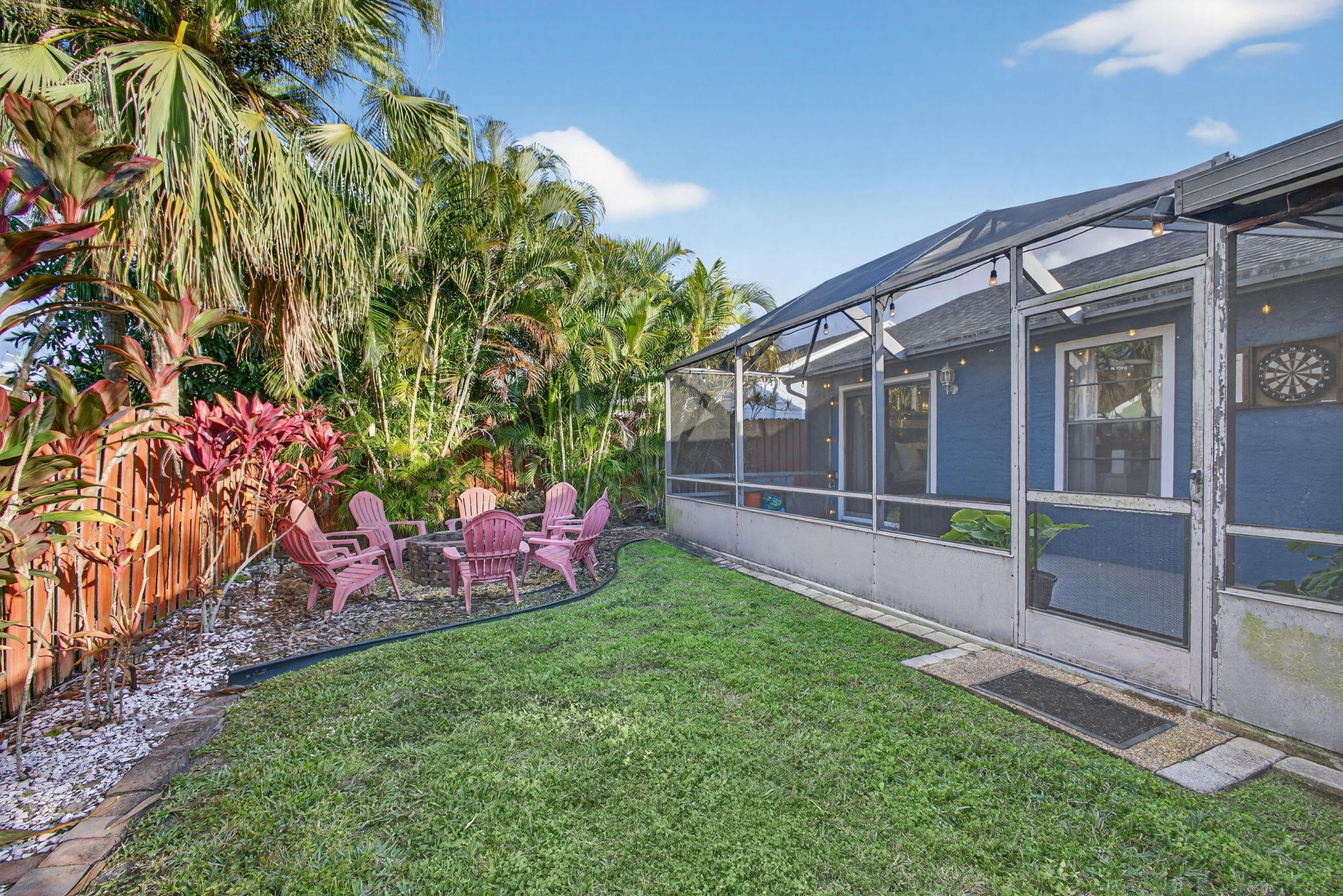 154 Rosewood Circle Jupiter, FL 33458 - Photo 35 of 43 a view of an house with backyard and garden