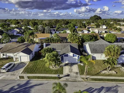 a aerial view of a house with a yard