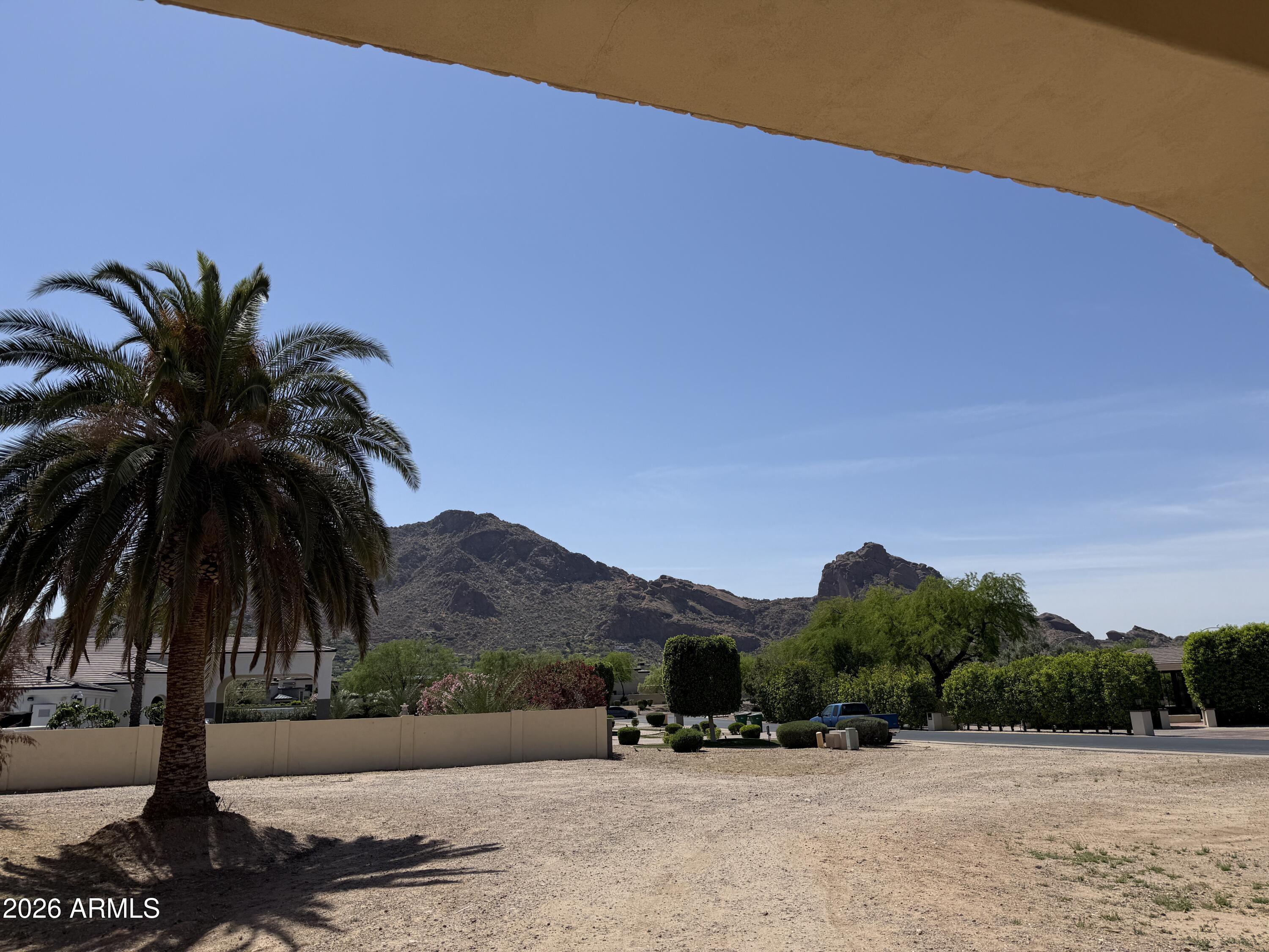 6525 North Lost Dutchman Road Paradise Valley, AZ 85253 - Photo 10 of 81 a view of lake with a mountain in the background